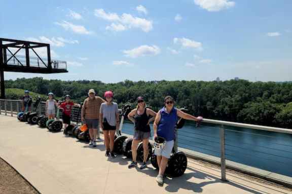 a group of people sitting at a dock