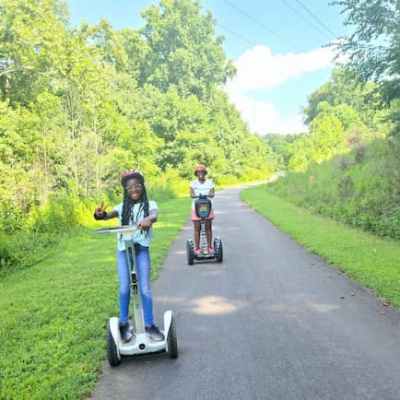 a person riding a bike on a road