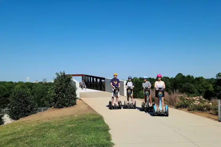 a group of people riding on the back of a park