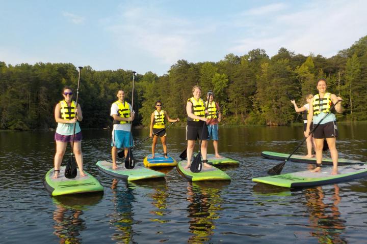 Group of people on paddleboards on lake