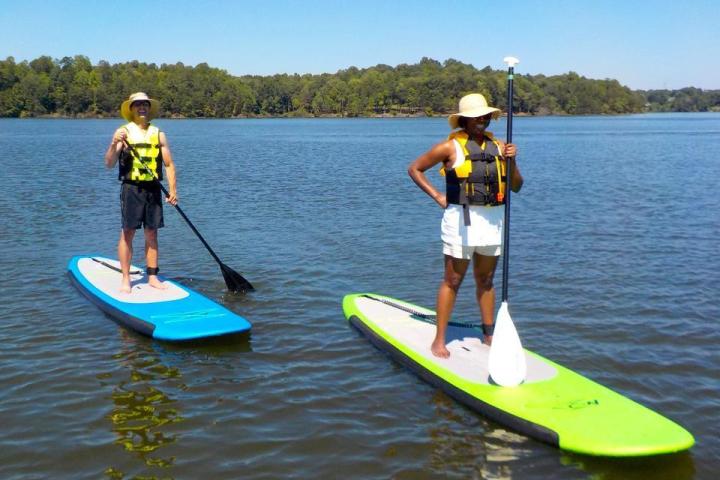 Couple on Stand Up Paddle boards on Oak Hollow Lake