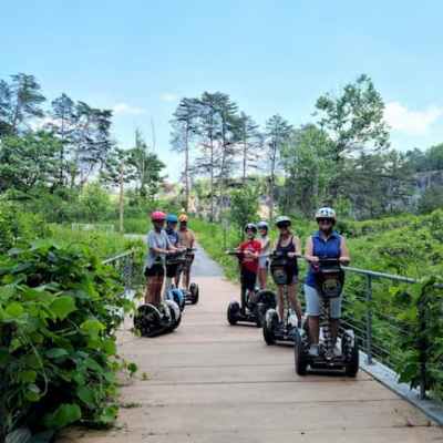 a group of people riding on the back of a motorcycle