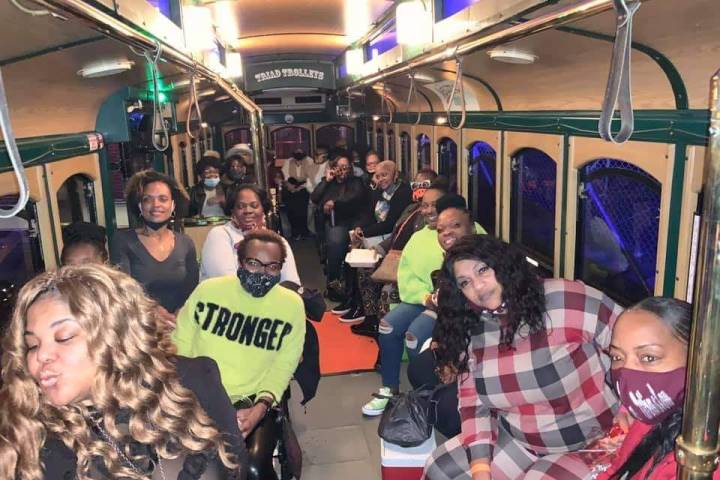 a group of people sitting at a train station
