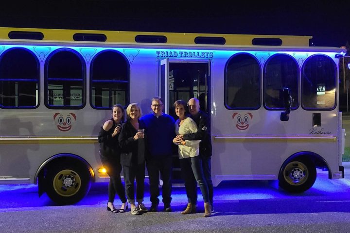 a person standing in front of a bus