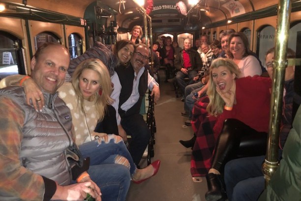 a group of people sitting at a train station