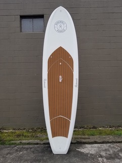 a person is surfing in front of a building