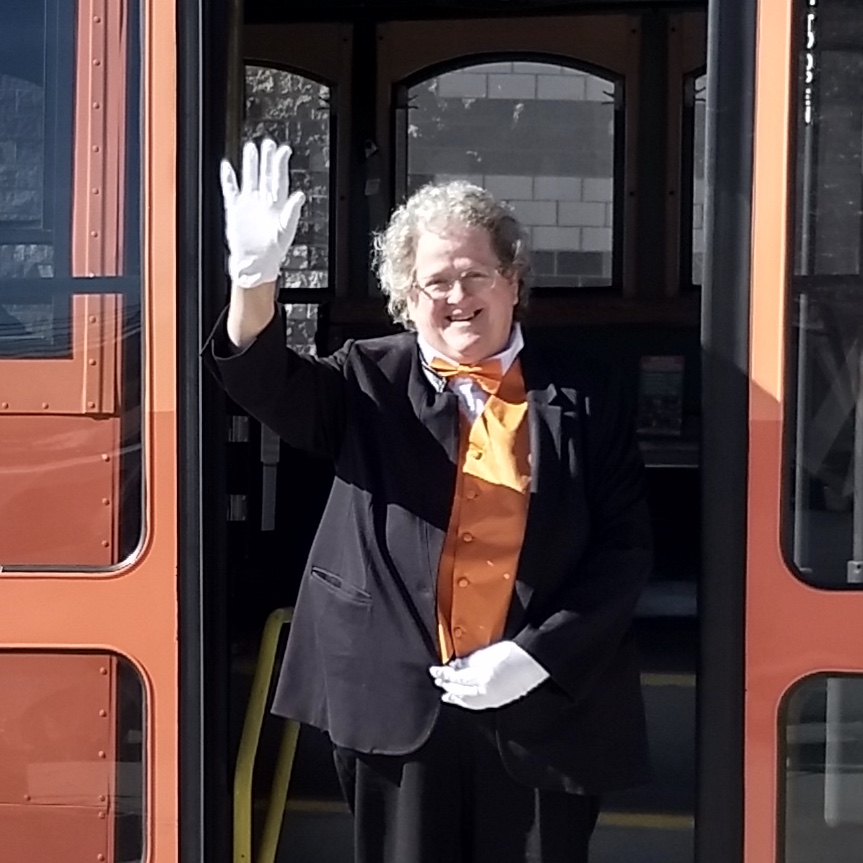 a man standing in front of a bus