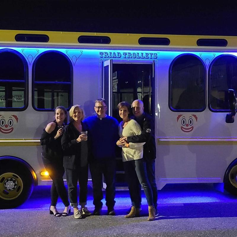 a person standing in front of a bus