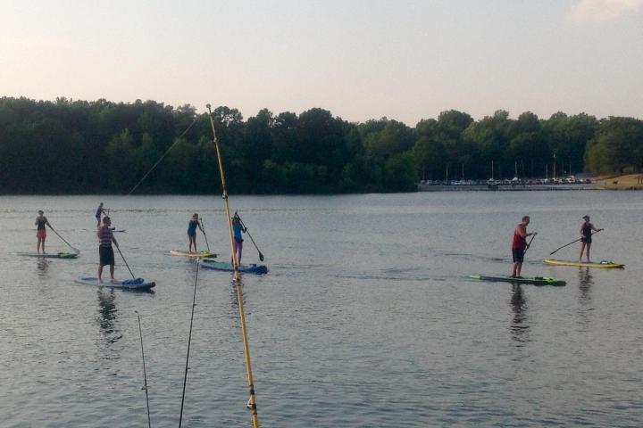 a group of people in a boat on a body of water